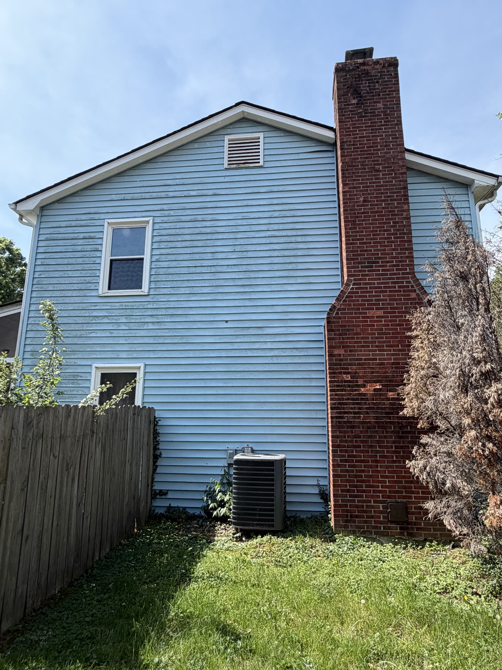 Blue siding before pressure washing in Central Kentucky